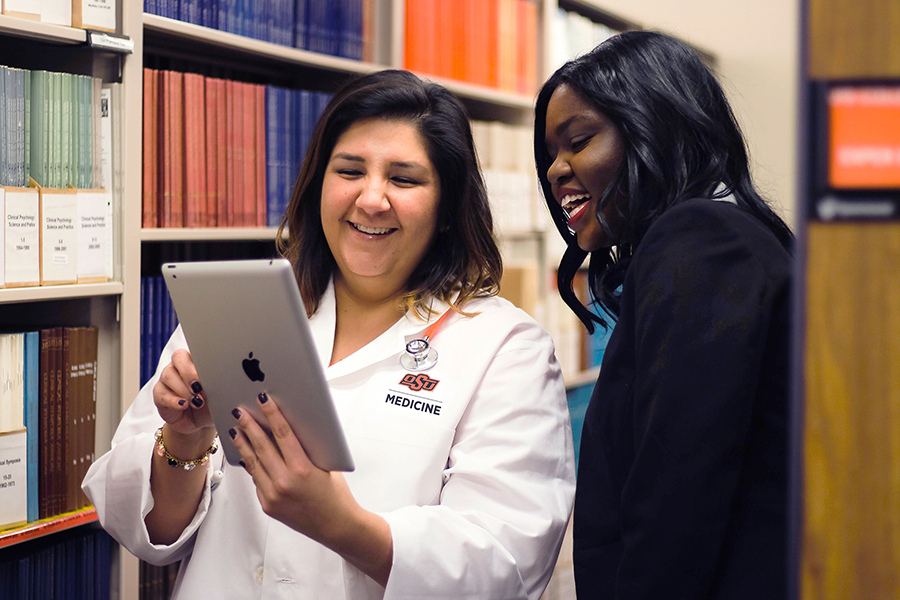 Faculty and student in the library