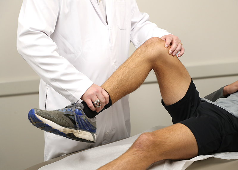 Close up shot of Dr. Chad Hanson examining a patient at OSU Medical Center (hospital) in Tulsa, Oklahoma.