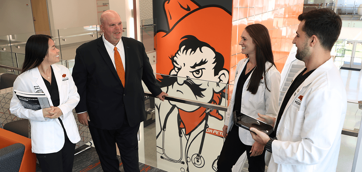 President Johnny Stephens with medical students President Johnny Stephens standing in North Hall with medical students.
