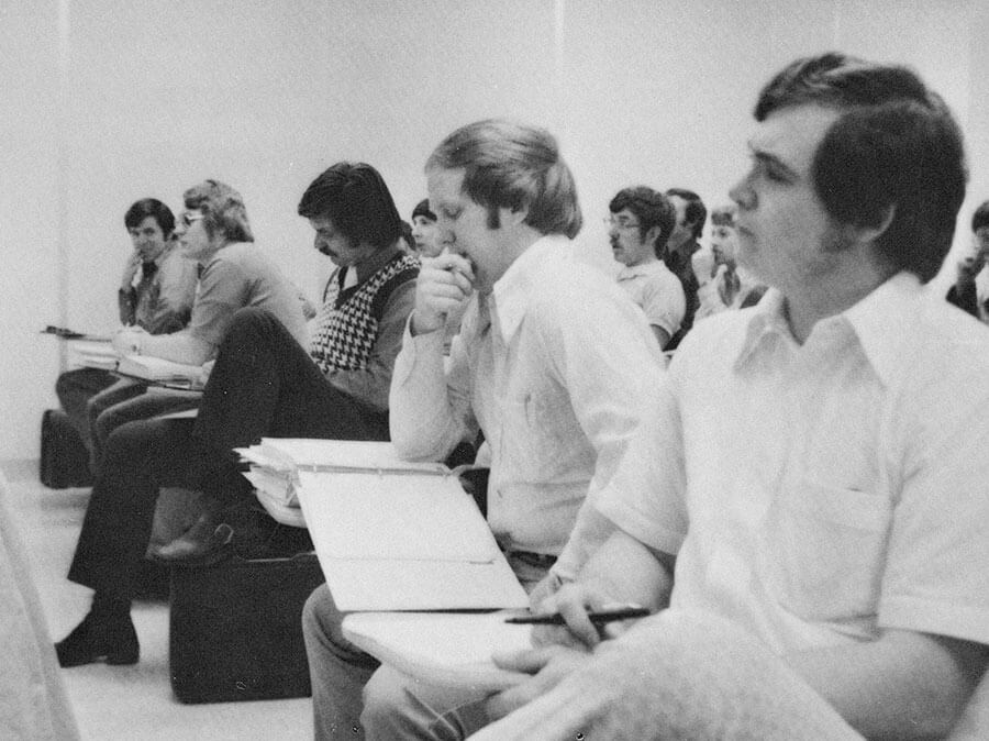 historic photo of students attending class