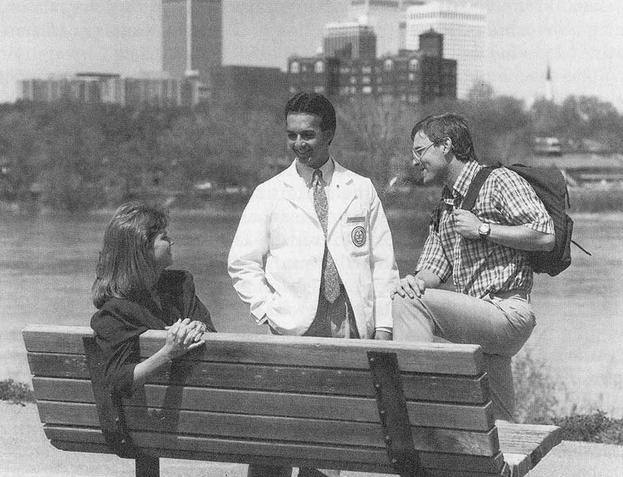 Three third-year students are pictured on the college grounds in 1988
