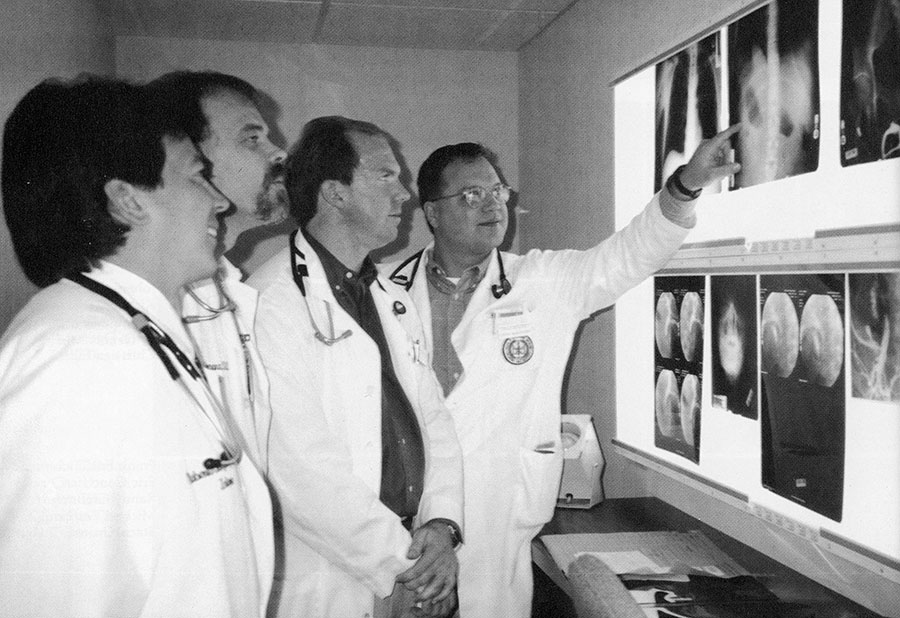Interns Bobby Gonzales and Jerry Lemons demonstrate some of the intricacies of radiology to Tom Milligan and John McGovern. Interns Bobby Gonzales and Jerry Lemons demonstrate some of the intricacies of radiology to Tom Milligan and John McGovern.