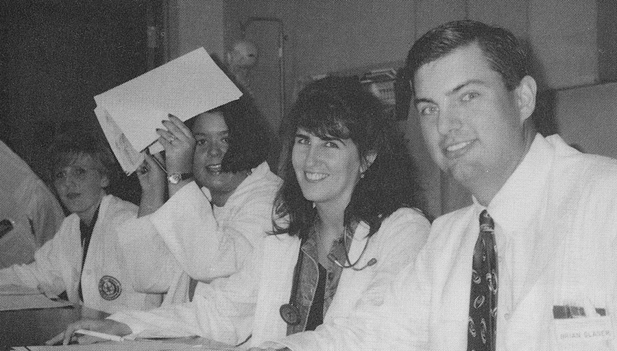 Kim Sorenson, Elizabeth Monnot, Jules Prichard, and Brian Glaser caught setting around the table during a patient conference a the Health Care Center. Kim Sorenson, Elizabeth Monnot, Jules Prichard, and Brian Glaser caught setting around the table during a patient conference a the Health Care Center.