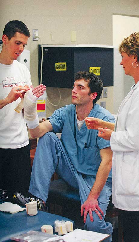 Eric Canaday, Ty Kirkpatrick with Carolyn Stelle, D.O., in the casting lab.