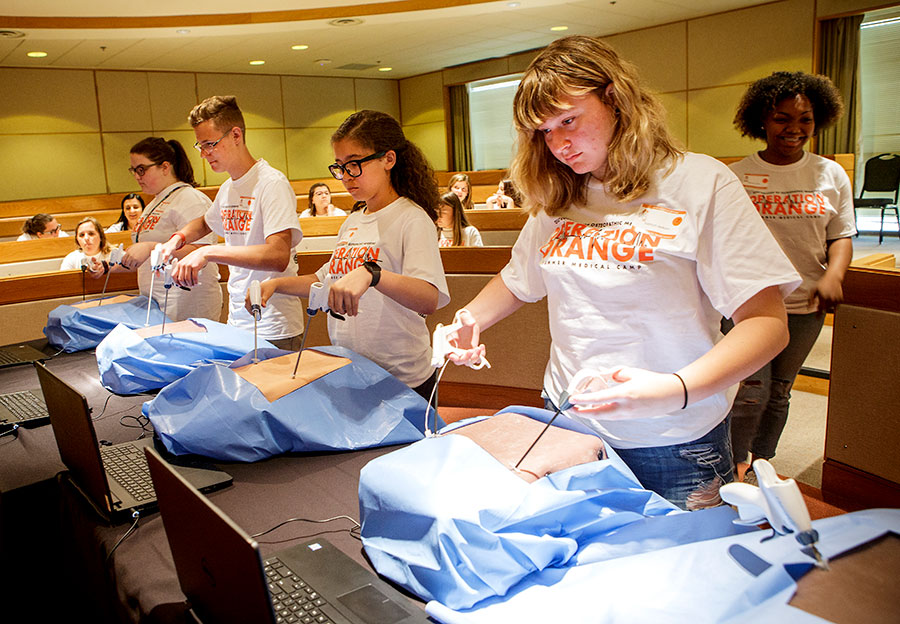 Students practice intubation during an Operation Orange event. Students practice intubation during an Operation Orange event.