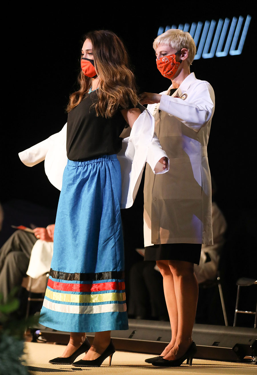 Students and faculty take part in the inaugural white coat ceremony at the Oklahoma State University College of Osteopathic Medicine at the Cherokee Nation in Tahlequah, Oklahoma. Students and faculty take part in the inaugural white coat ceremony at the Oklahoma State University College of Osteopathic Medicine at the Cherokee Nation in Tahlequah, Oklahoma.