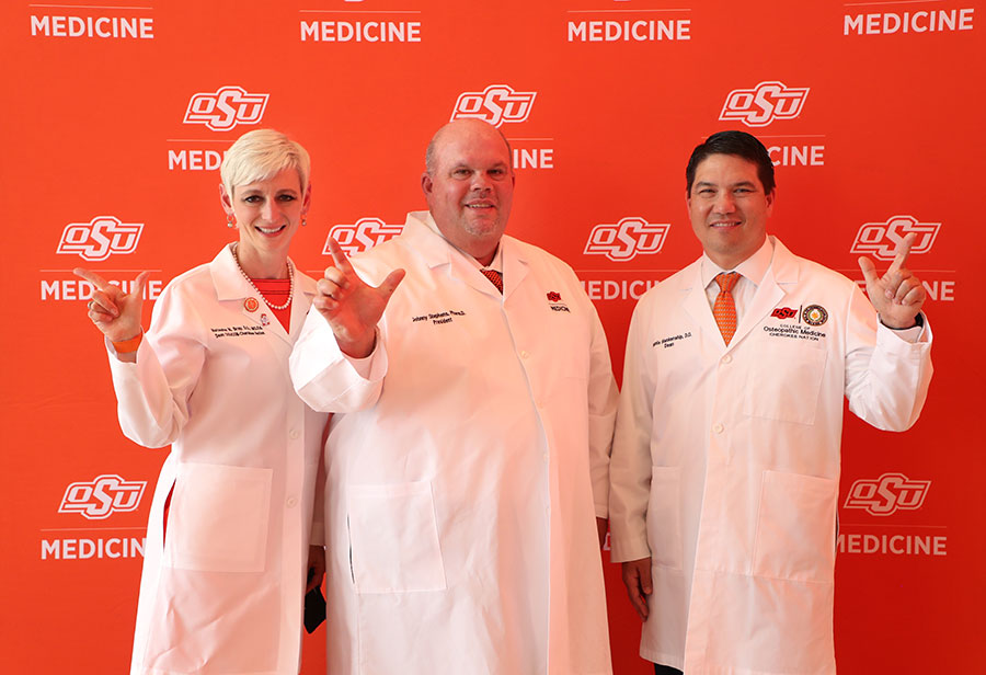 Drs. Natasha Bray (left), Johnnie Stephens and Dennis Blankenship (right) at the white coat ceremony for incoming medical students in the Oklahoma State University College of Osteopathic Medicine at the Cherokee Nation in Tahlequah, Oklahoma. Drs. Natasha Bray (left), Johnnie Stephens and Dennis Blankenship (right) at the white coat ceremony for incoming medical students in the Oklahoma State University College of Osteopathic Medicine at the Cherokee Nation in Tahlequah, Oklahoma.