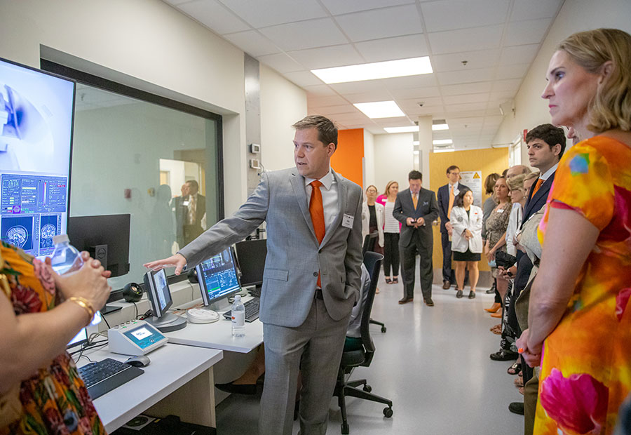 Kyle Simmons (center) leads a tour during a ribbon cutting at the Hardesty Center for Clinical Research and Neuroscience in Tulsa, Oklahoma. Kyle Simmons (center) leads a tour during a ribbon cutting at the Hardesty Center for Clinical Research and Neuroscience in Tulsa, Oklahoma.