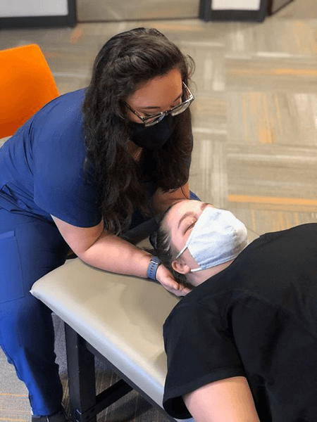 First-year medical student, Becca, practices her OMM skills. First-year medical student, Becca, practices her OMM skills.