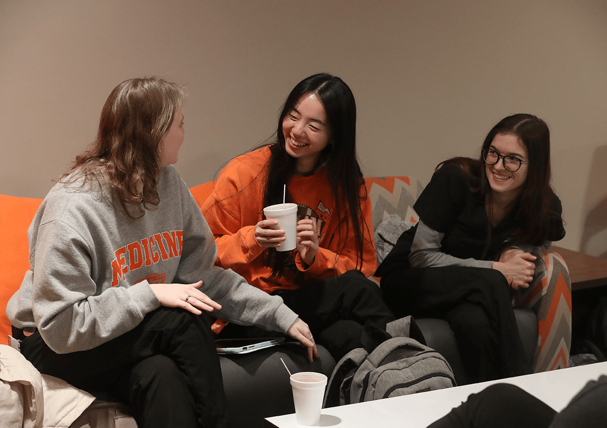 Medical students Karlyn Tanzey (left), Avery Lewis and Jordan Wilson (right) enjoy hot chocolate in the student center at the OSU Center for Health Sciences in Tulsa, Ok Medical students Karlyn Tanzey (left), Avery Lewis and Jordan Wilson (right) enjoy hot chocolate in the student center at the OSU Center for Health Sciences in Tulsa, Ok