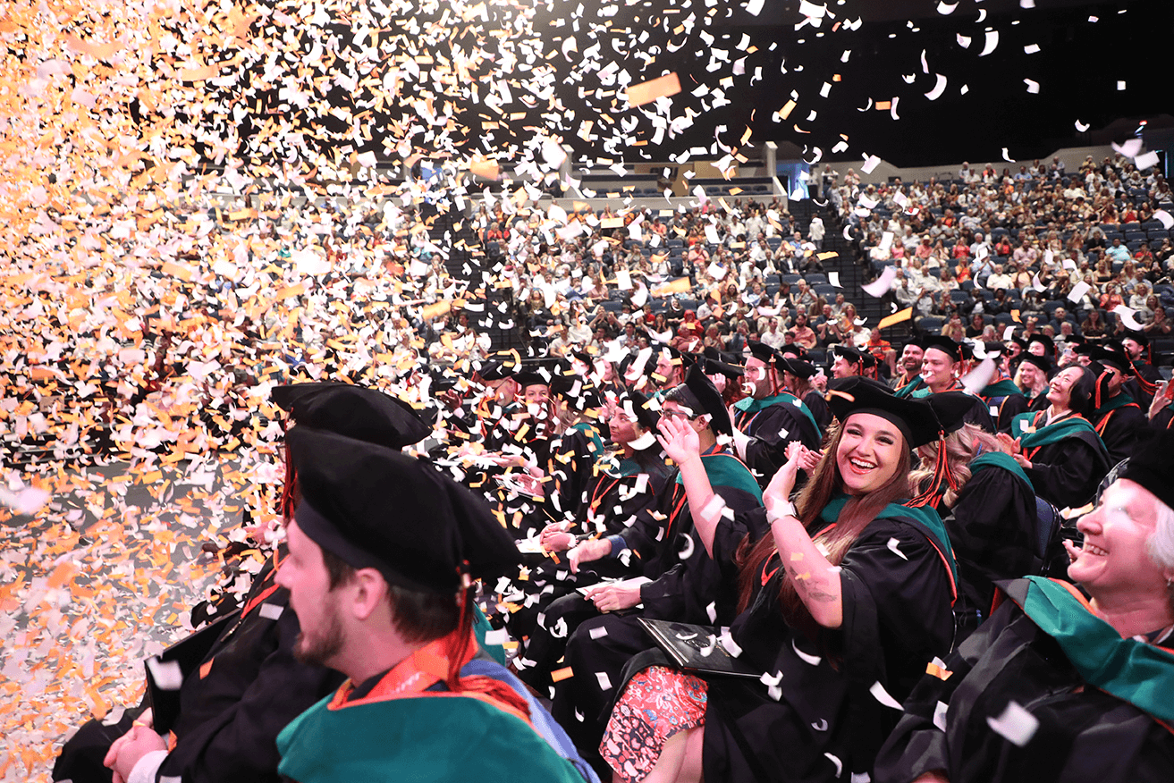Medical students celebrating amidst confetti at their commencement ceremony in 2023. Medical students celebrating amidst confetti at their commencement ceremony in 2023.