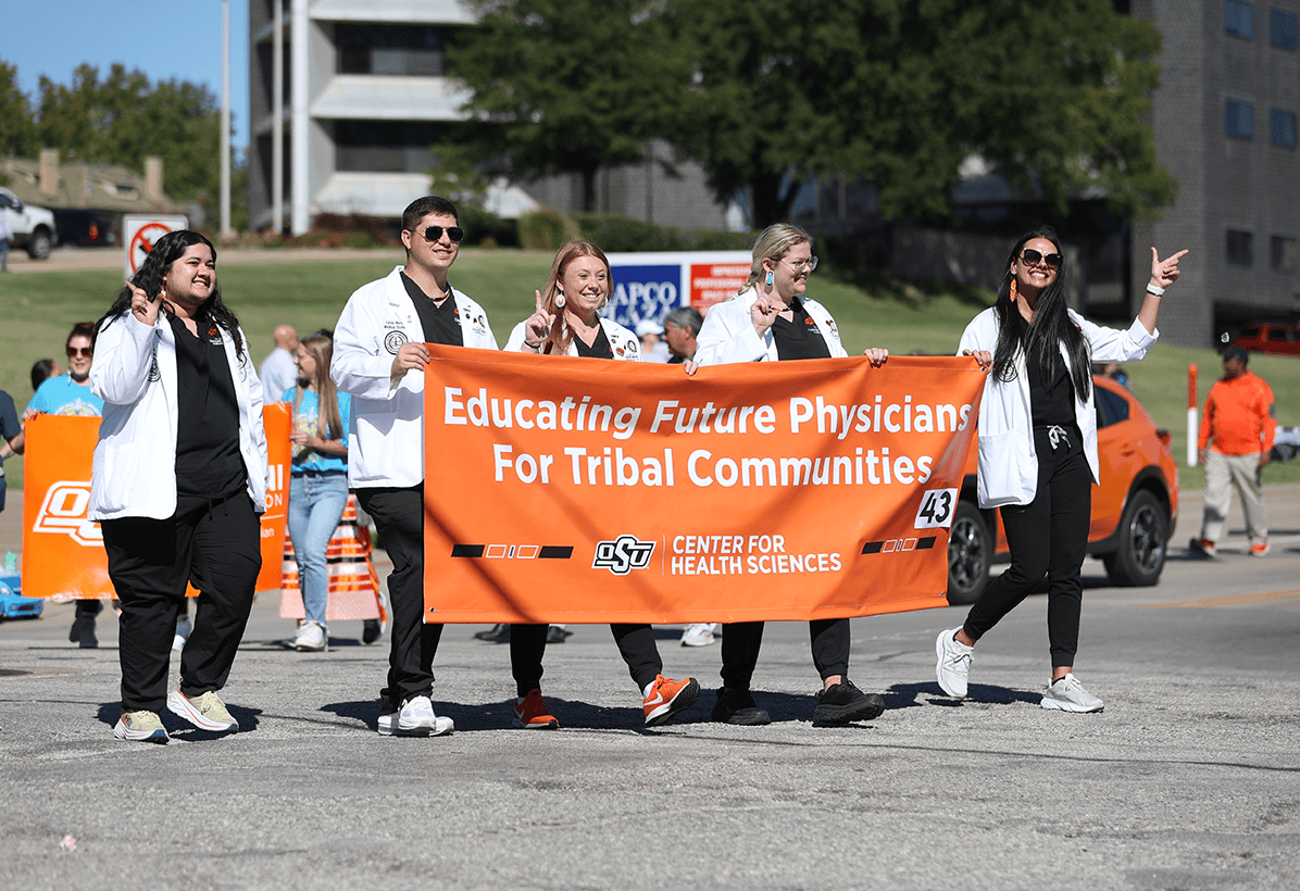 Members of NASOM (North American Society of Obstetric Medicine) march in the Native American Day Parade in Tulsa, Oklahoma. Members of NASOM (North American Society of Obstetric Medicine) march in the Native American Day Parade in Tulsa, Oklahoma.