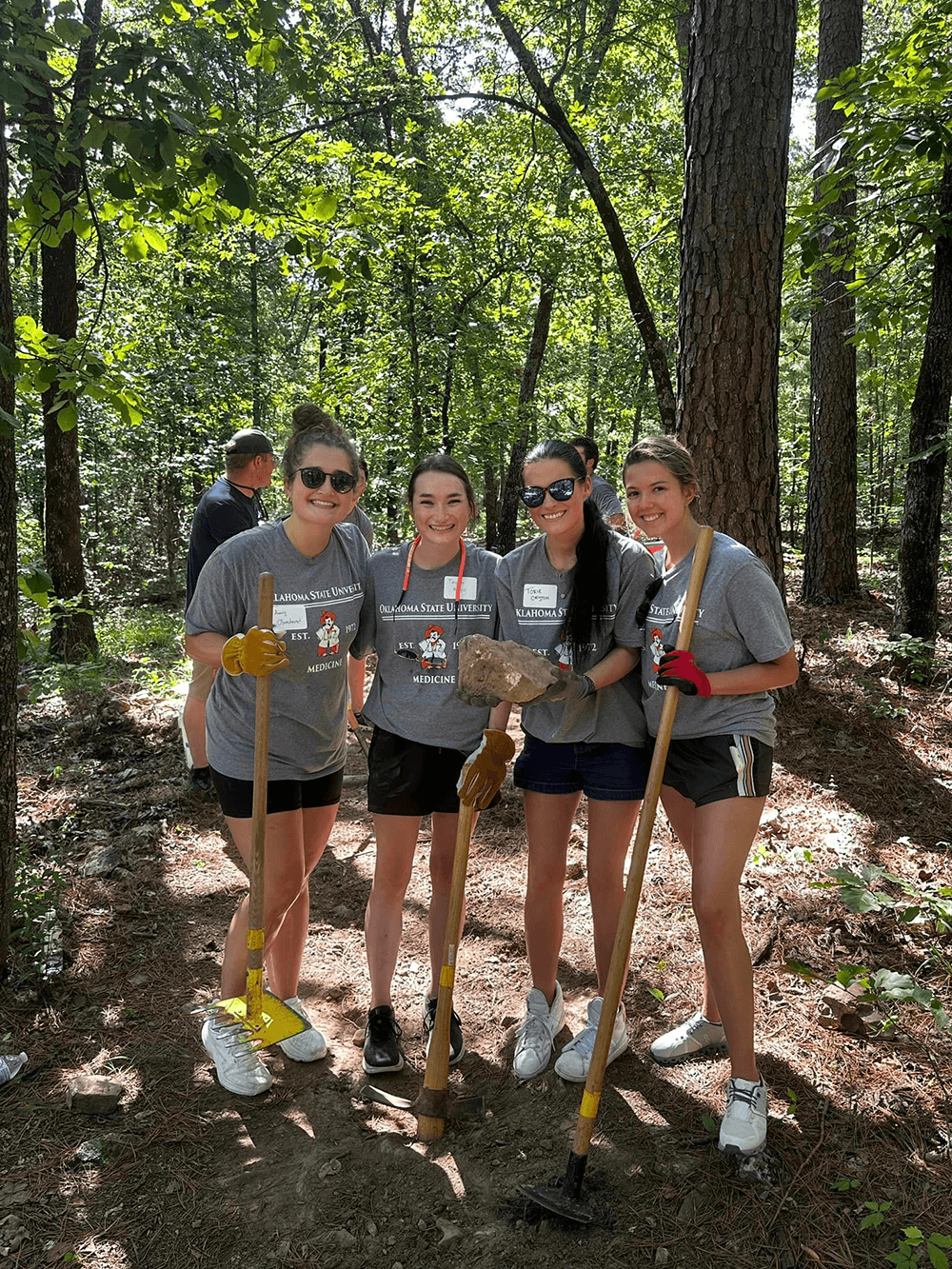 OSU-CHS students plant trees as part of Dr. Pete's Big Event. OSU-CHS students plant trees as part of Dr. Pete