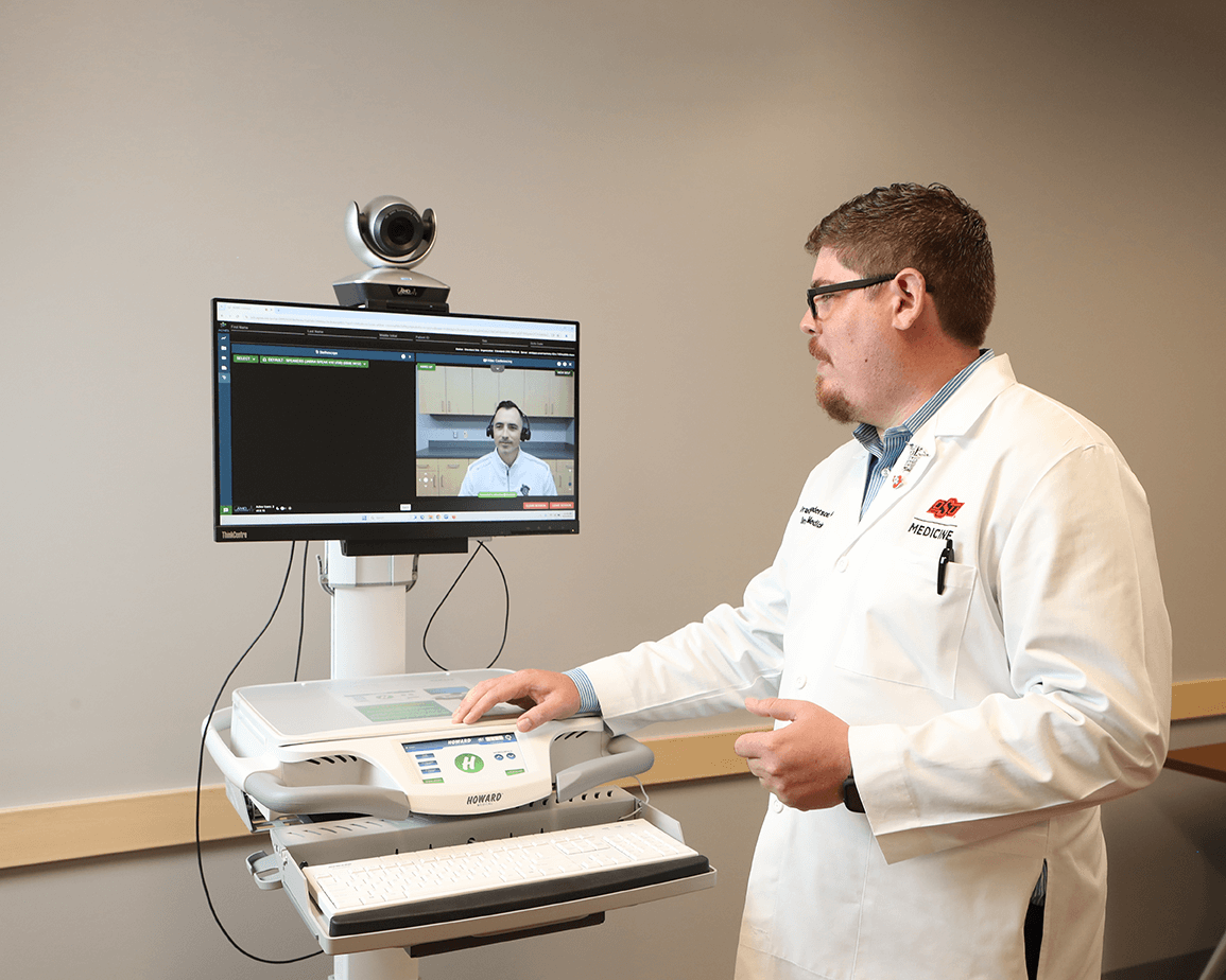 Doctor using a virtual monitor to speak with a patient.